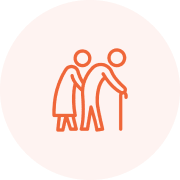 Elderly couple walking with a cane.