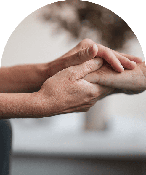 Hands offering comfort through gentle touch.